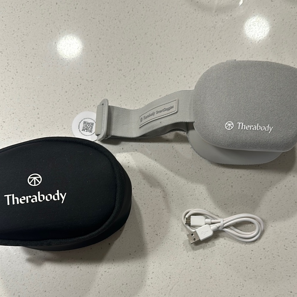 Therabody Gray and Black smart goggles